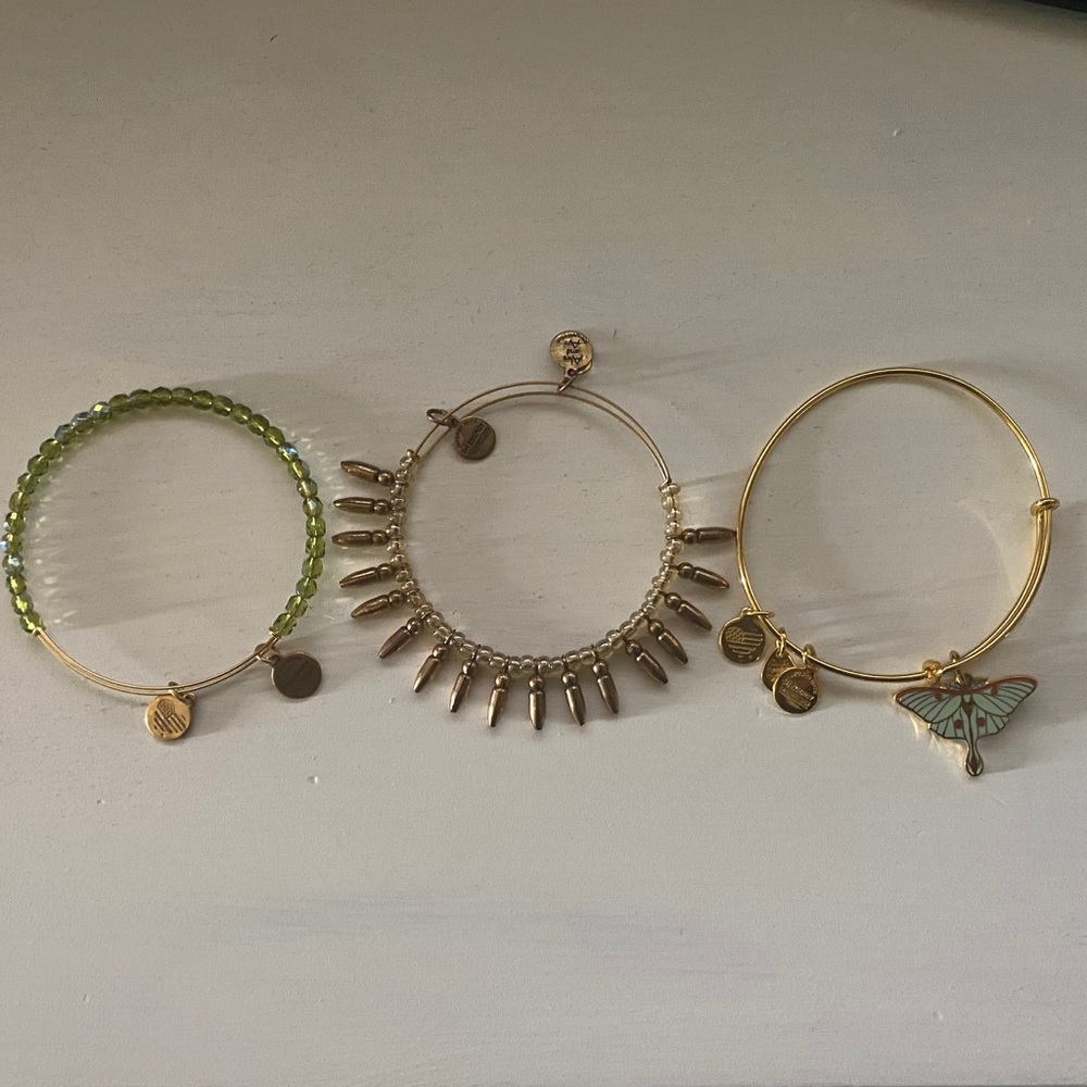 3 gold tone Alex and Ani bracelets